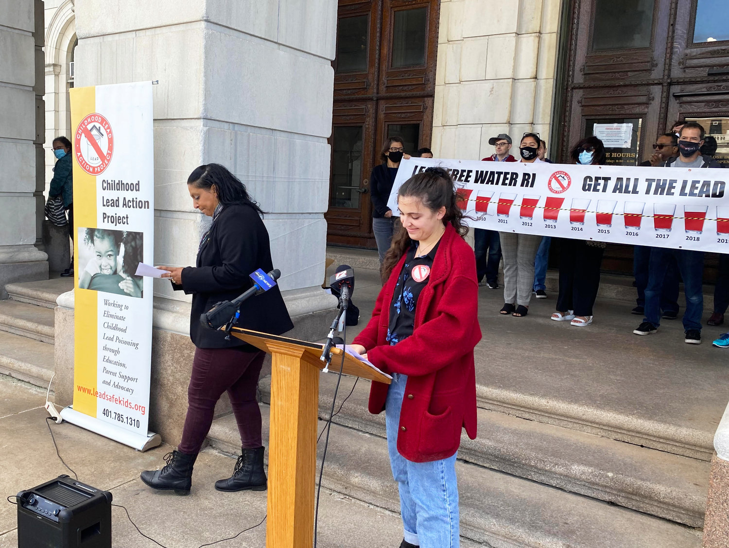 Devra Levy, community organizer with the Childhood Lead Action Project, speaking at a news conference in October of 2021 at the State House.